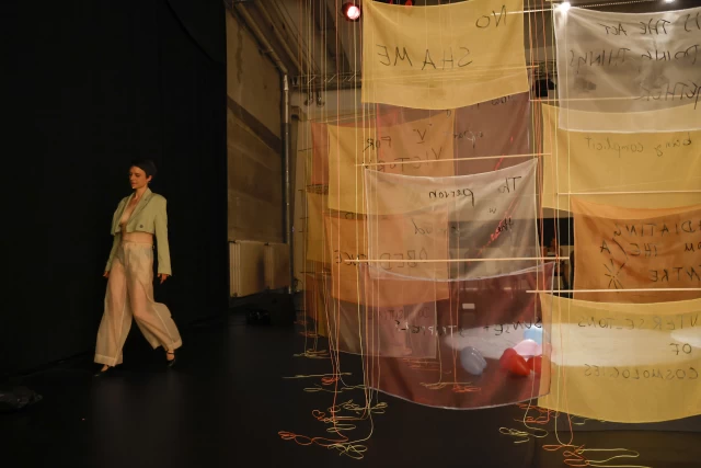 Britta behind banners, Tanzfabrik Berlin, June 2021 – photo by Anja Weber